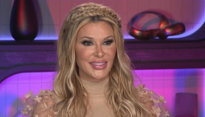 Brandi Glanville gives unwanted kisses to Caroline Manzo during shooting