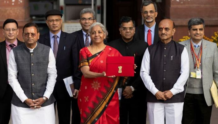 Indias Finance Minister Nirmala Sitharaman holds up a folder with the Government of Indias logo as she leaves her office to present the federal budget in parliament in New Delhi, February 1, 2023.— Reuters