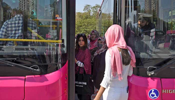 Women boarding the Pink Bus after the inauguration ceremony in Karachi on February 1, 2023. — Online