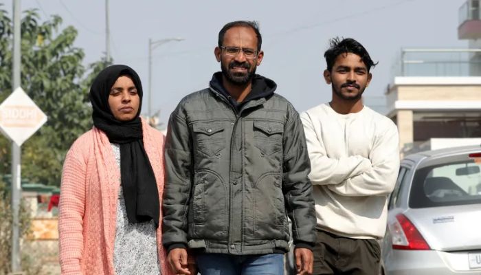 Journalist Siddique Kappan with his wife and son after he was released from Lucknow District Jail on February 2.— AFP