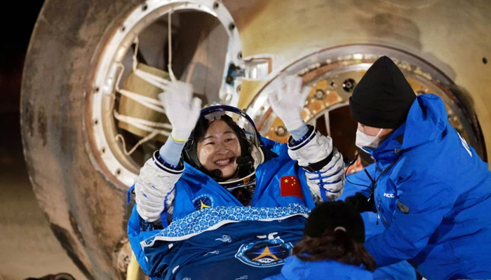 Astronaut Liu Yang waves as she is out of a return capsule of the Shenzhou-14 spacecraft, following a six-month mission on Chinas space station, at the Dongfeng landing site in Inner Mongolia Autonomous Region, China December 4, 2022. — Reuters