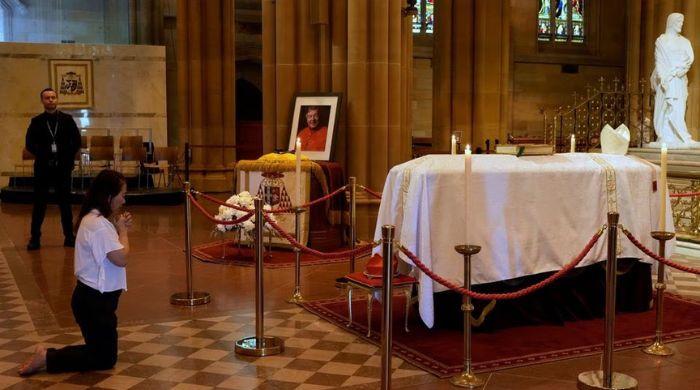 Australian Cardinal George Pell's funeral sparks protests as mourners gather