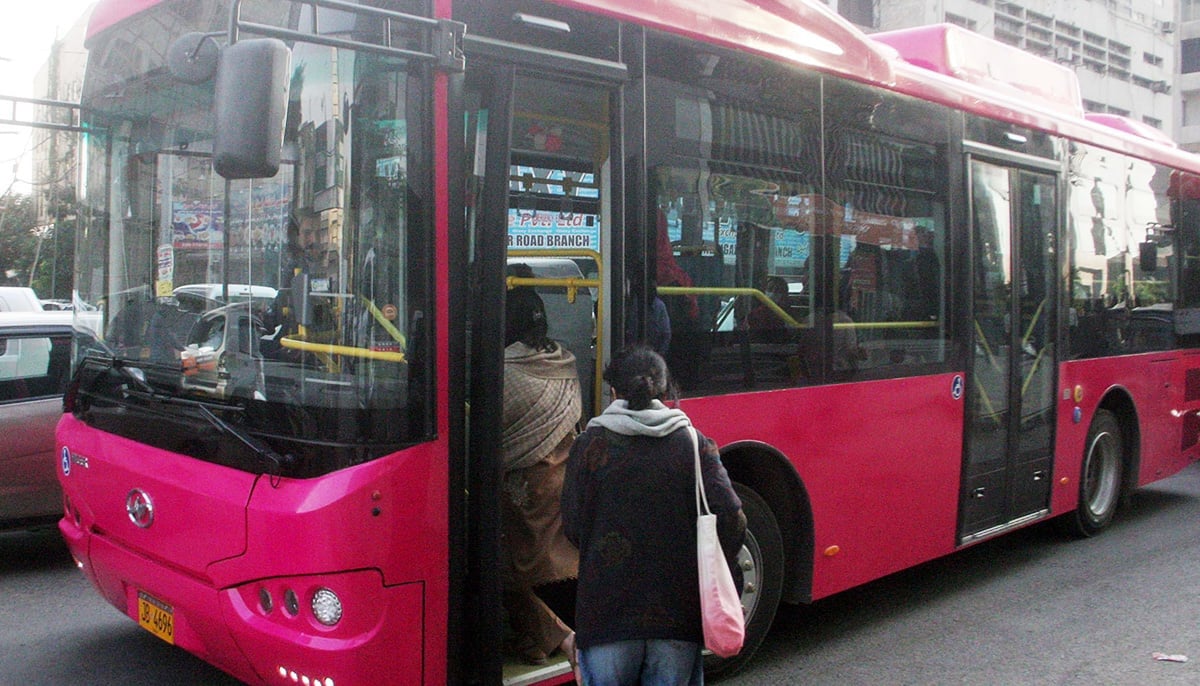 Women board the Pink bus at II Chundrigar Road Karachi on February 2, 2023. — Online