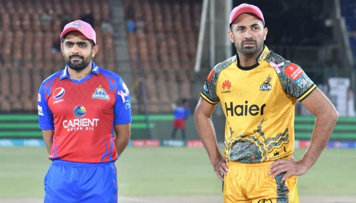Wahab (R) and Babar (L) share a light moment during toss of a PSL match — PCB