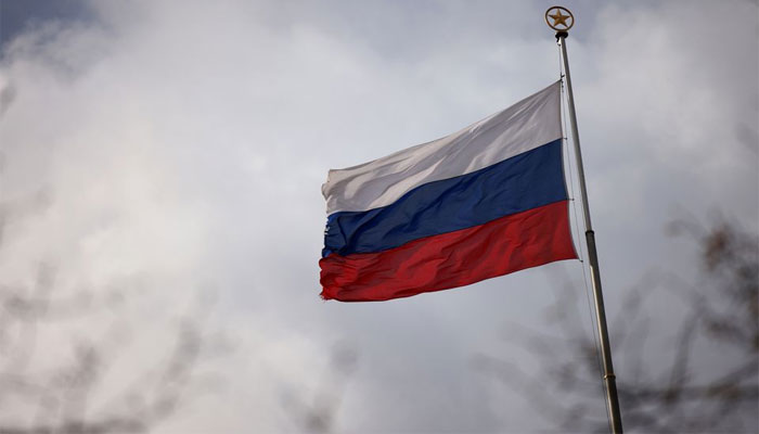 The national flag of Russia flies atop the Russian embassy in Berlin, Germany. — Reuters/File