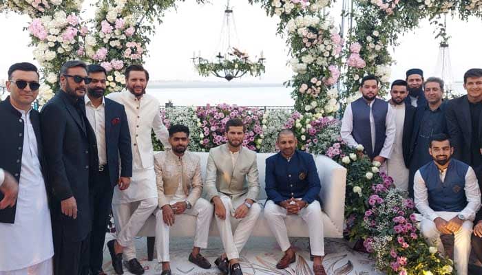 Shaheen Afridi poses with his father-in-law Shahid Afridi and fellow cricketers including Babar Azam and Sarfaraz Ahmed during his Nikah reception in Karachi on February 3, 2023. — Photo by author
