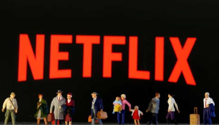 Small toy figures are seen in front of displayed Netflix logo in this illustration taken March 19, 2020.— Reuters