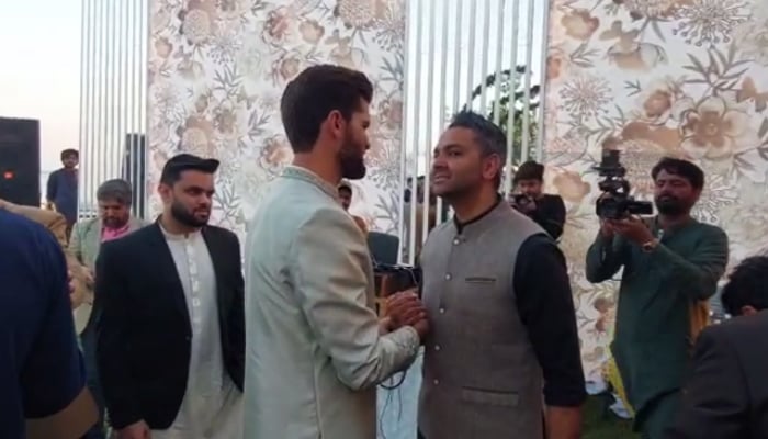 Shaheen Shah Afridi (centre left) meets former PCB official Wasim Khan during the Nikah reception in Karachi, on February 3, 2023. — Photo by author