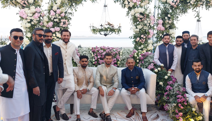 Shaheen Afridi (centre) poses with his father-in-law Shahid Afridi (fourth from left) and fellow cricketers including during his Nikah reception in Karachi on February 3, 2023. — Photo by author