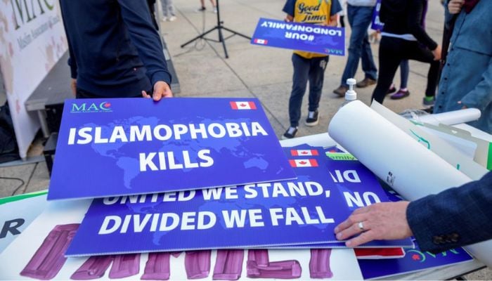 Attendees return signs after a rally to highlight Islamophobia, sponsored by the Muslim Association of Canada, including the June 6 in London, Ontario attack which killed a Muslim family in what police describe as a hate-motivated crime, in Toronto, Ontario, Canada June 18, 2021.— Reuters