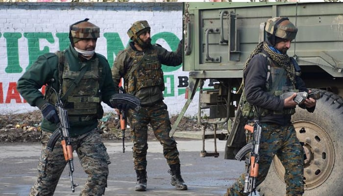 Indian Army soldiers arrive near the site of a gun battle in Pinglan village in IIOJKs Pulwama district on February 18, 2019. — Reuters