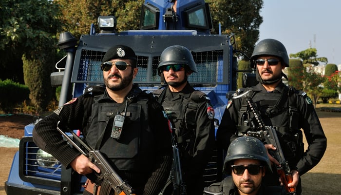 Police personnel stand guard in this undated photo. — KP Police
