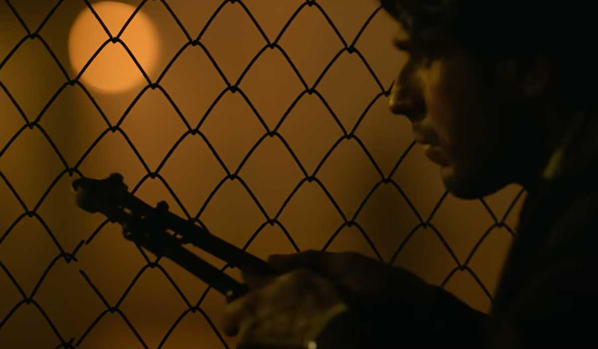 In this sequence, the lead character is seen cutting breaching into a security zone. — Screengrab via YouTube/Netflix India