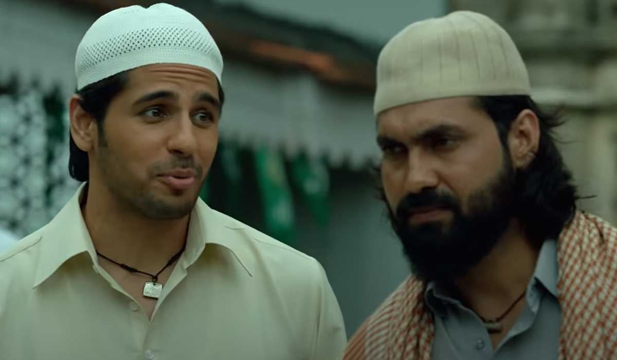 Actor Sidharth Malhotra portrays the stereotypical appearance with a skull cap and amulet in this scene. — Screengrab via YouTube/Netflix India