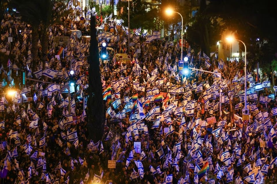 Israelis hold flags as they protest against Prime Minister Benjamin Netanyahus new right-wing coalition and its proposed judicial reforms to reduce powers of the Supreme Court in Tel Aviv, Israel February 4, 2023. — Reuters
