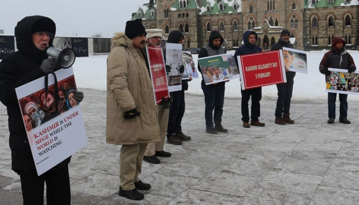 Office-bearers and members of Kashmir Committee Ottawa staging a protest demonstration in front of the Canadian Parliament in Ottawa in Connection with the Kashmir Solidarity Day. — APP