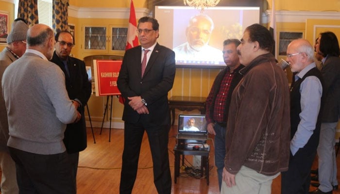 Pakistan High Commissioner to Canada Zaheer A. Janjua speaking to a group of Pakistani and Kashmiri diaspora gathered at the Pakistan High Commission in Ottawa to attend a pictorial exhibition. — APP