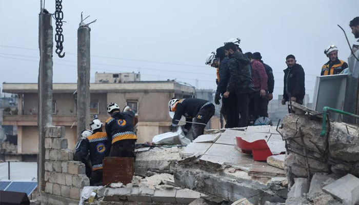 Rescuers search for survivors under the rubble of a damaged building in rebel-held Azaz, Syria. — Reuters.
