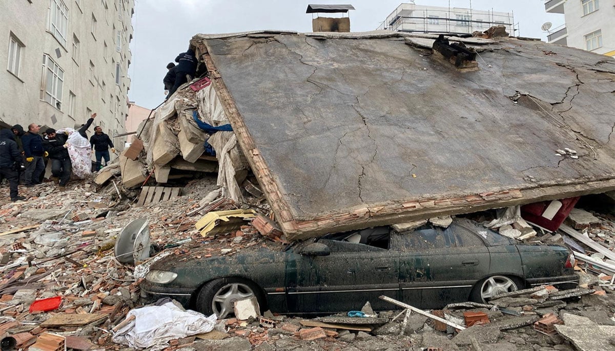 People search through rubble following an earthquake in Diyarbakir, Turkey. — Reuters