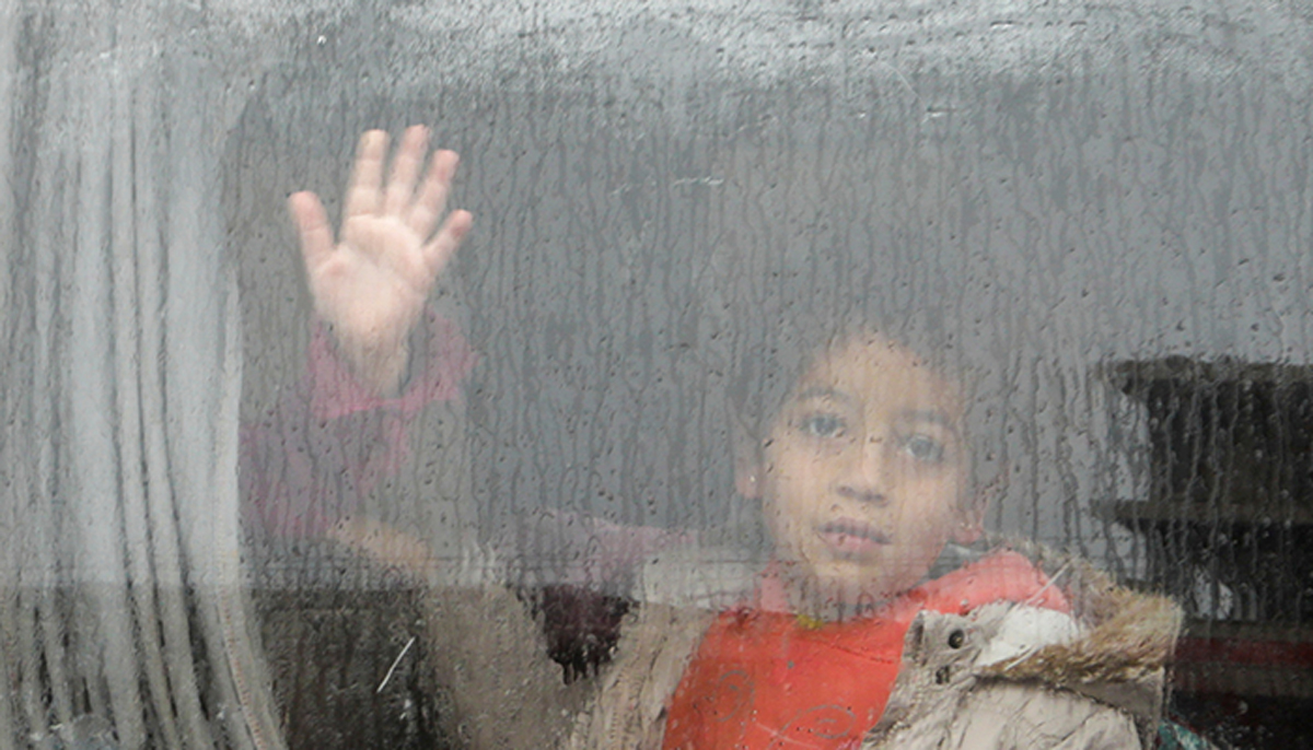 A child looks out through a window of a car, following an earthquake, in the rebel-held town of Jandaris, Syria February 6, 2023. — Reuters
