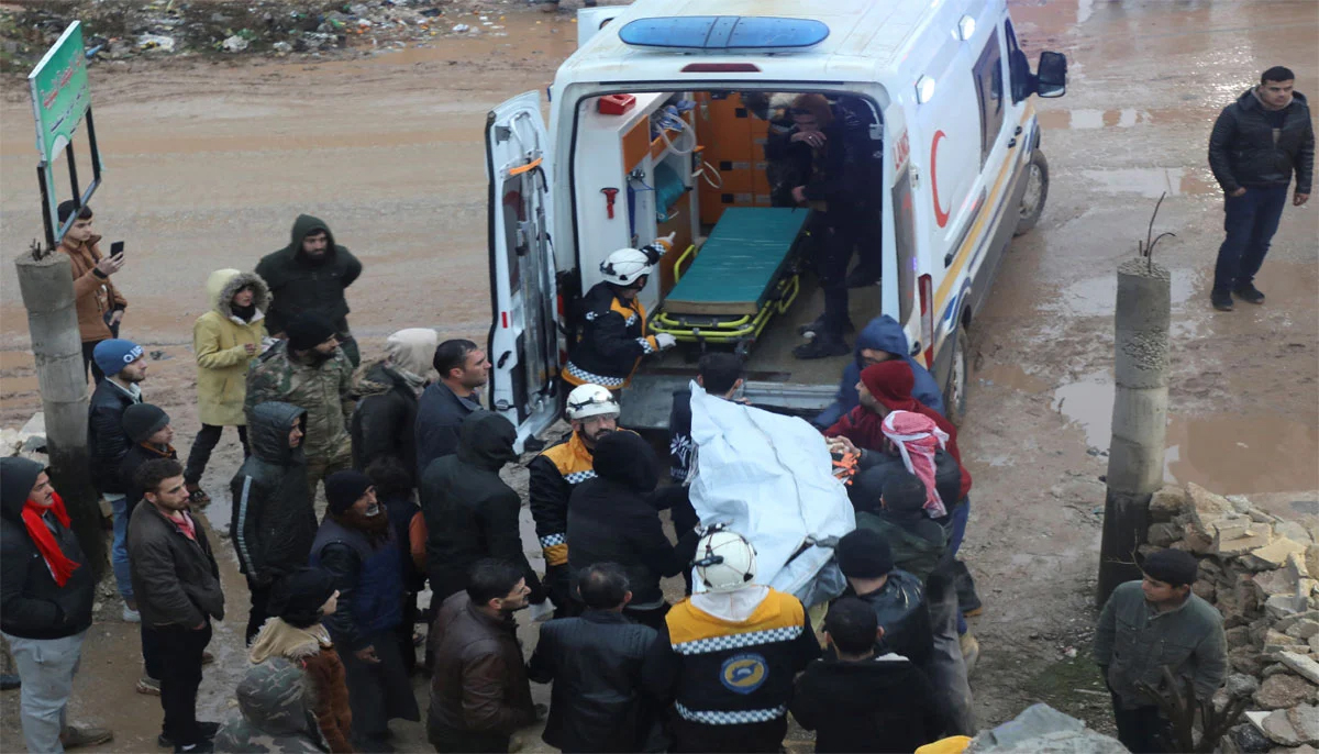 Rescuers carry a casualty into an ambulance at the site of a damaged building, following an earthquake, in rebel-held Azaz, Syria. — Reuters