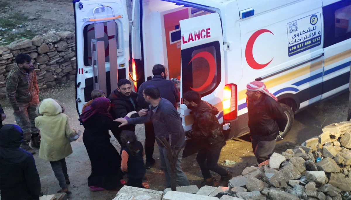 Rescuers carry a casualty into an ambulance at the site of a damaged building, following an earthquake, in rebel-held Azaz, Syria. — Reuters