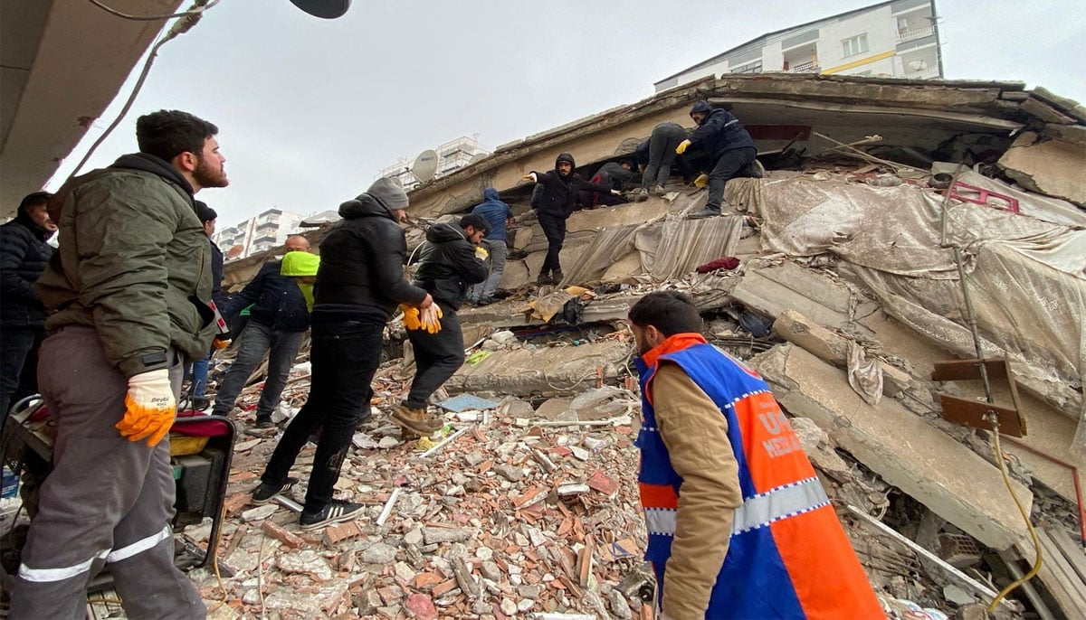 People search through rubble following an earthquake in Diyarbakir. — Reuters