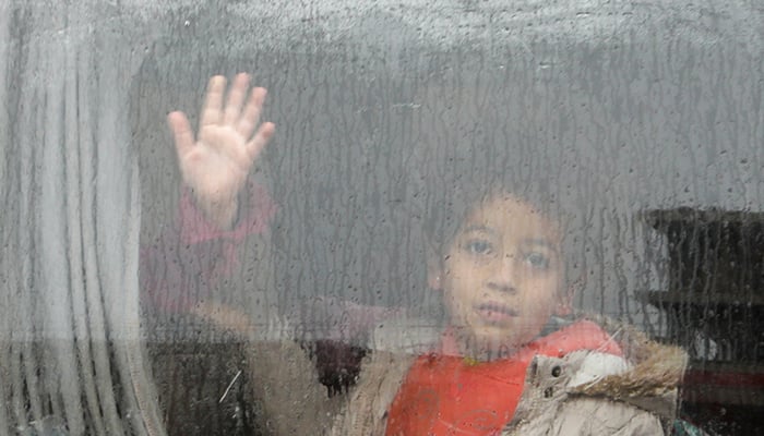 A child looks out through a window of a car, following an earthquake, in rebel-held town of Jandaris, Syria February 6, 2023. — Reuters