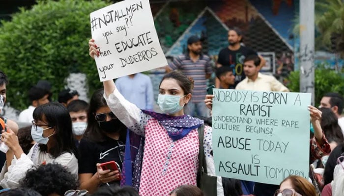 Protesters in Karachi carry signs against a gang rape that occurred along a highway. — Reuters/File