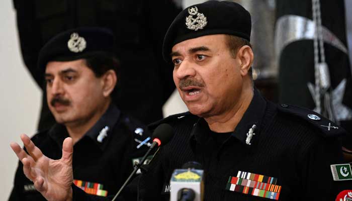 Moazzam Jah Ansari (R), head of the Khyber-Pakhtunkhwa province police force, speaks during a press conference at the Police Headquarters in Peshawar on February 2, 2023. — AFP