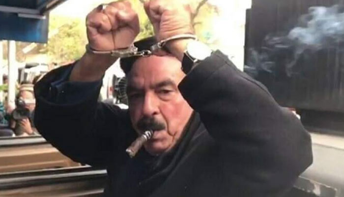 Awami Muslim League (AML) chief Sheikh Rashid photographed handcuffed on February 2, 2023. — Screengrab/Twitter