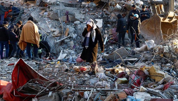 A woman looks at the destruction following an earthquake in Kahramanmaras, Turkey, February 8, 2023. — Reuters