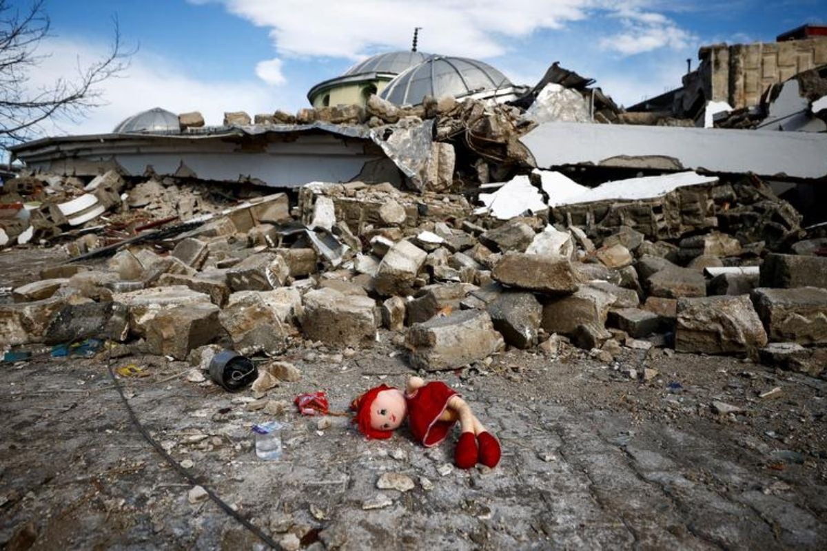 A doll lies on the ground near the site of a collapsed mosque, following an earthquake in Hatay, Turkey, February 7.— Reuters