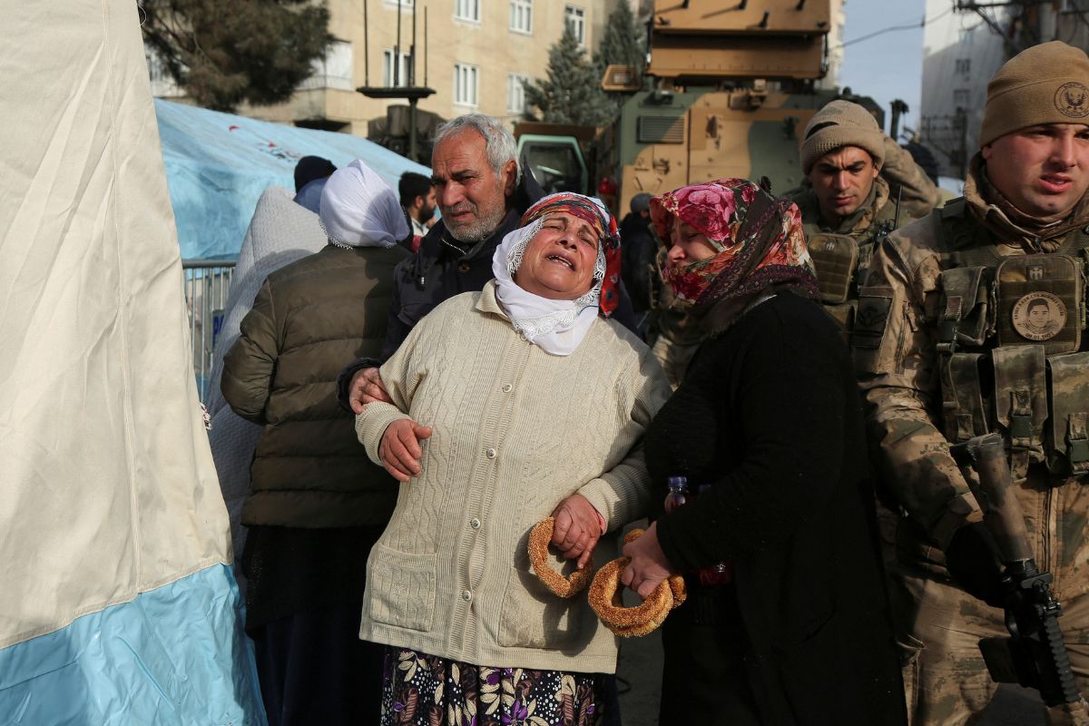 People react as they stand near the site of a collapsed building in Diyarbakir, Turkey February 8, 2023.— Reuters