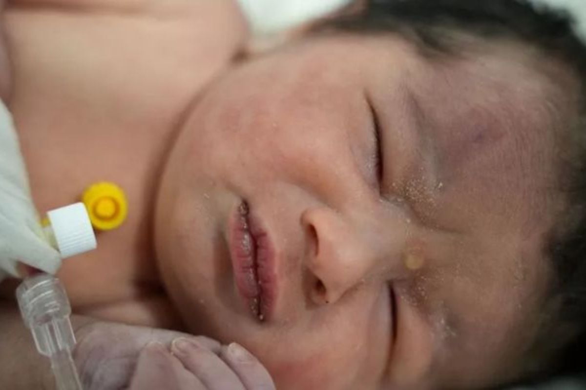 Rescue workers pulled a newborn baby girl from the ruins of a building in northwest Syria that had been demolished by an earthquake on Monday. — AFP