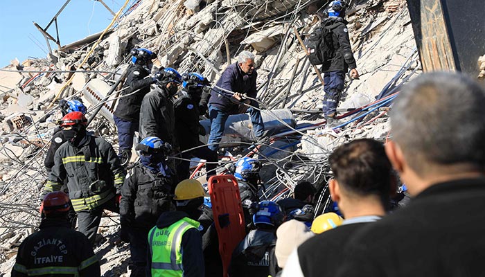 Malaysian and Turkish rescuers look for survivors under the rubble of collapsed buildings in Nurdagi, in the countryside of Gaziantep, on February 9, 2023. — AFP