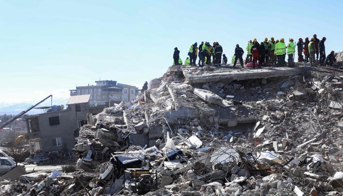 Rescuers and civilians look for survivors under the rubble of collapsed buildings in Nurdagi, in the countryside of Gaziantep, on February 9, 2023, three days after a deadly earthquake that hit Turkey and Syria. AFP