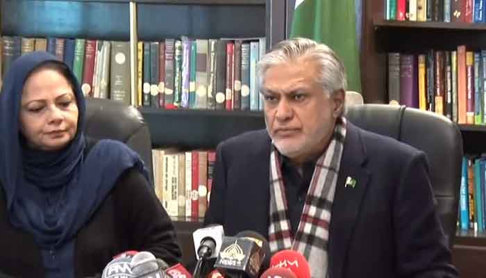 Finance Minister Ishaq Dar and State Minister for Finance Aisha Ghaus Pasha addressing the media in Islamabad. — Screengrab