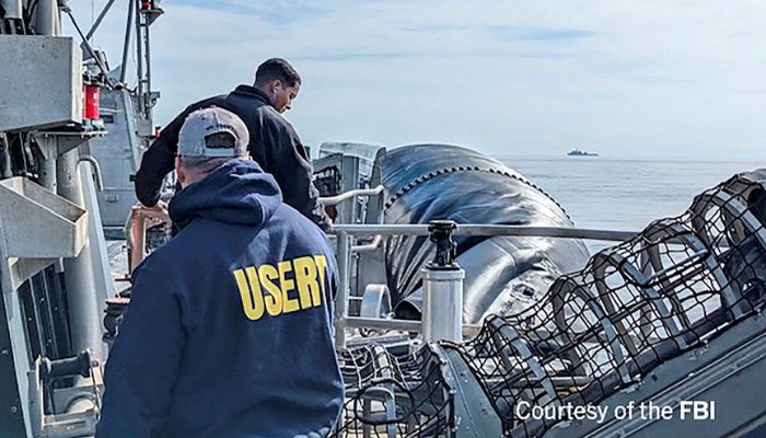 An undated U.S. Federal Bureau of Investigation handout photo taken aboard the USS Carter Hull off South Carolina shows FBI Special Agents assigned to the bureau’s Evidence Response Team ready to process material recovered from the high-altitude Chinese balloon that was shot down by a U.S. military jet off the coast of South Carolina, in this image released by the FBI in Washington, U.S. February 9, 2023.— Reuters