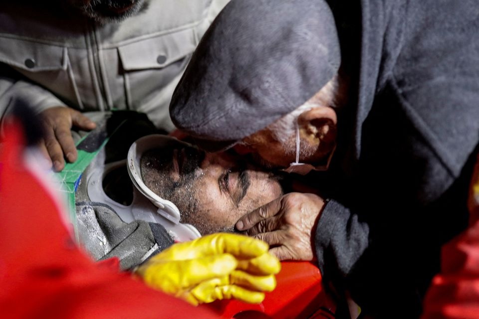 A person who is rescued out of rubble is kissed on his forehead, as the search for survivors continues, in the aftermath of a deadly earthquake, in Hatay, Turkey, February 10, 2023.— Reuters