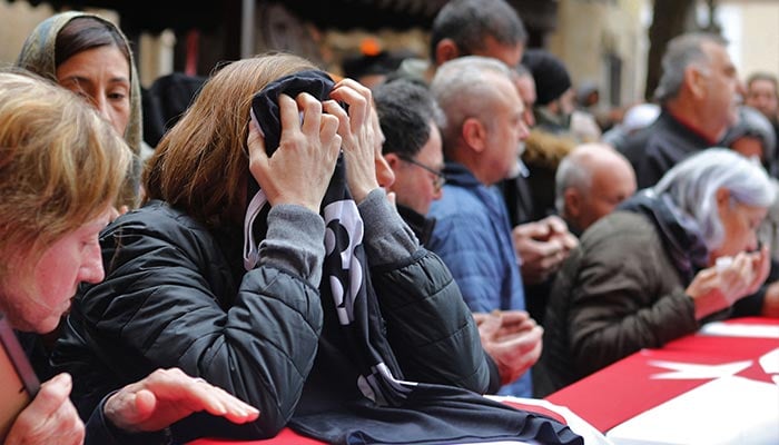 Mourners attend the funeral of seven Cypriot students killed in a powerful earthquake that hit Turkey, on February 10, 2023 in Famagusta, in the breakaway Turkish Cypriot statelet of northern Cyprus. — AFP