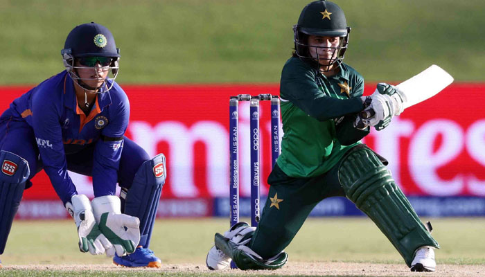 Pakistans Javeria Khan plays a shot watched by Indias wicket keeper Richa Ghosh (L) during the Round 1 Womens Cricket World cup match between India and Pakistan at Bay Oval in Tauranga. — AFP/File
