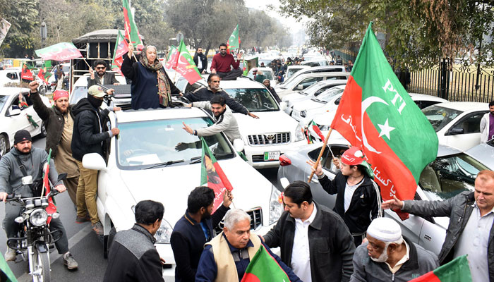 Activists of Pakistan Tehreek-e-Insaf hold a protest in favour of their demands outside the Election Commission of Pakistan office, in Lahore. — Online/File