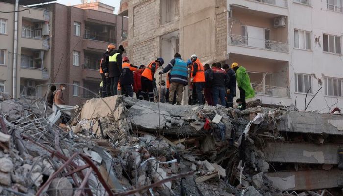 Members of a rescue team work on the site of a collapsed building, as the search for survivors continues, in the aftermath of a deadly earthquake, in Iskenderun, Turkey, February 11, 2023.— Reuters