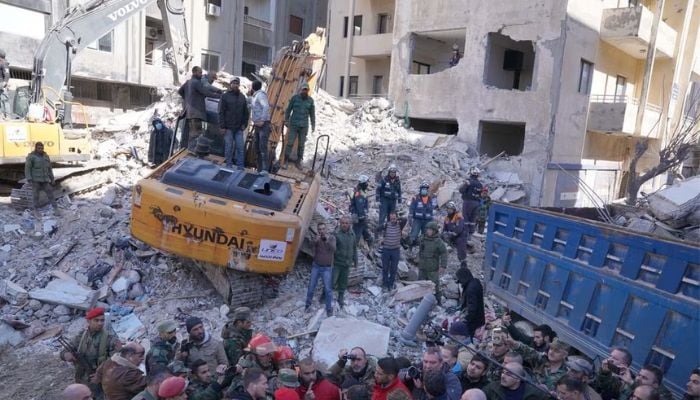 Syrian President Bashar al-Assad and his wife Asma al-Assad inspect rescue operations at the site of damaged buildings, in the aftermath of the earthquake, in Jableh , Syria, in this handout released by SANA on February 11, 2023.— Reuters