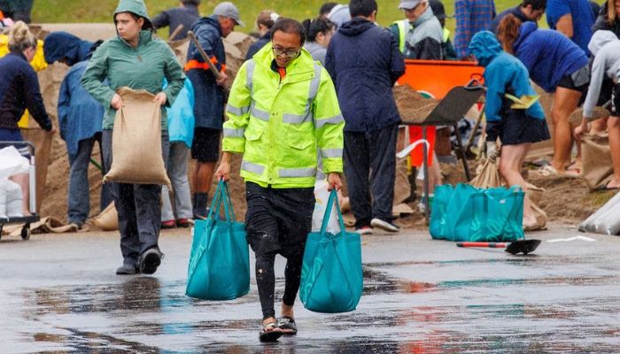 People fill up sandbags at a public collection point in preparation for the arrival of Cyclone Gabrielle in Auckland, New Zealand, February 12, 2023.— Reuters