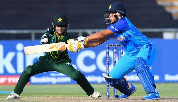 India’s Richa Ghosh (right) plays a shot as Pakistan’s wicketkeeper Muneeba Ali reacts during the Group B T20 women’s World Cup cricket match between India and Pakistan at Newlands Stadium in Cape Town on February 12, 2023. — AFP
