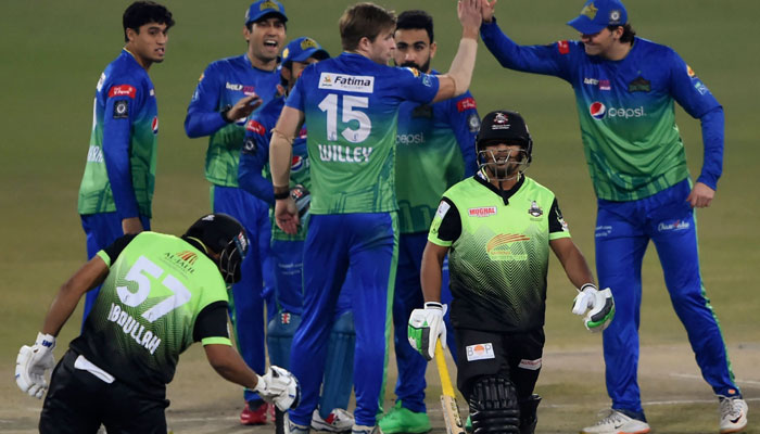 Multan Sultans players celebrate the dismissal of Lahore Qalandars Zeeshan Ashraf (2R) during the PSL Twenty20 final cricket at the Gaddafi Cricket Stadium in Lahore on February 27, 2022. — AFP