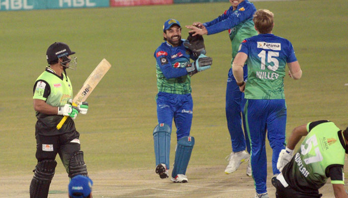 Multan Sultans players celebrate the dismissal of Lahore Qalandars Zeeshan Ashraf during the PSL T20 final cricket match between Lahore Qalandars and Multan Sultans at the Gaddafi Cricket Stadium in Provincial Capital. — Online/File