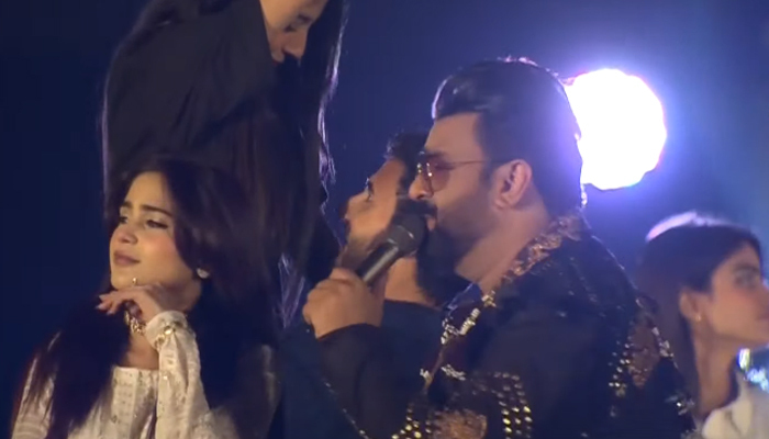 Aima Baig (left) and Sahir Ali Bagga (right) perform during the opening ceremony of the PSL 8 in Multan on February 13, 2023, in this still taken from a video. — YouTube/GeoNews